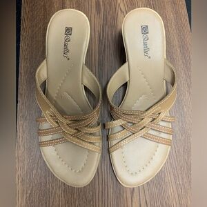 Quellu’s brown leather small wedge sandals. Like new size 9